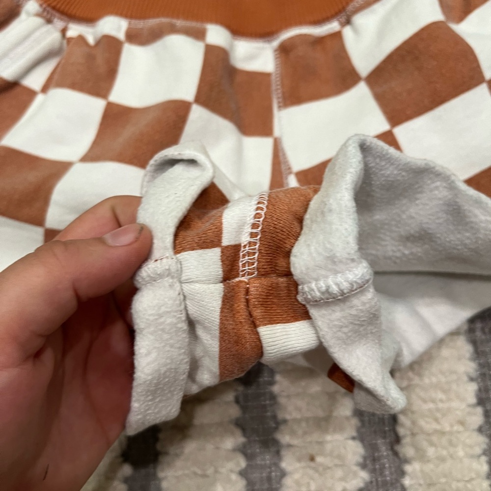 Out from under checkered shorts - Picture 5 of 11